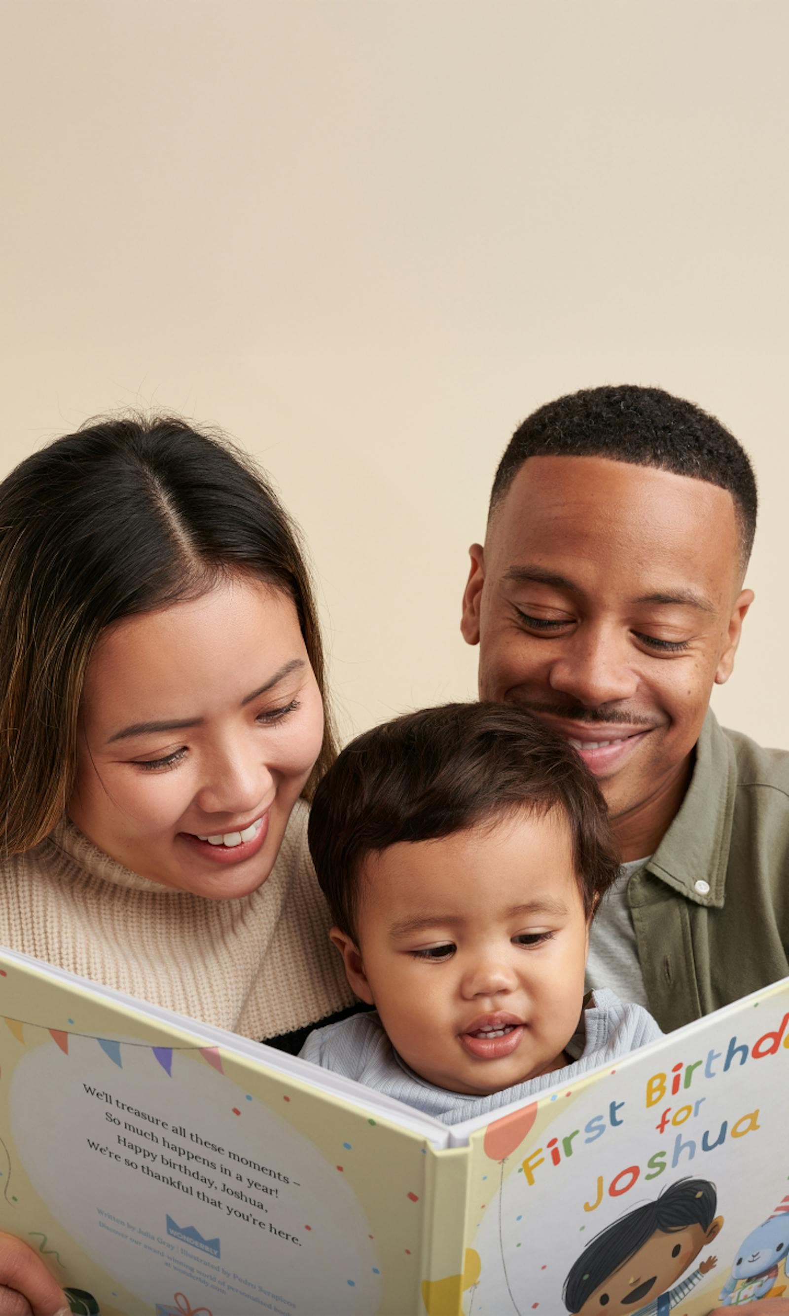 Parents and child reading a personalized "First Birthday for You" book